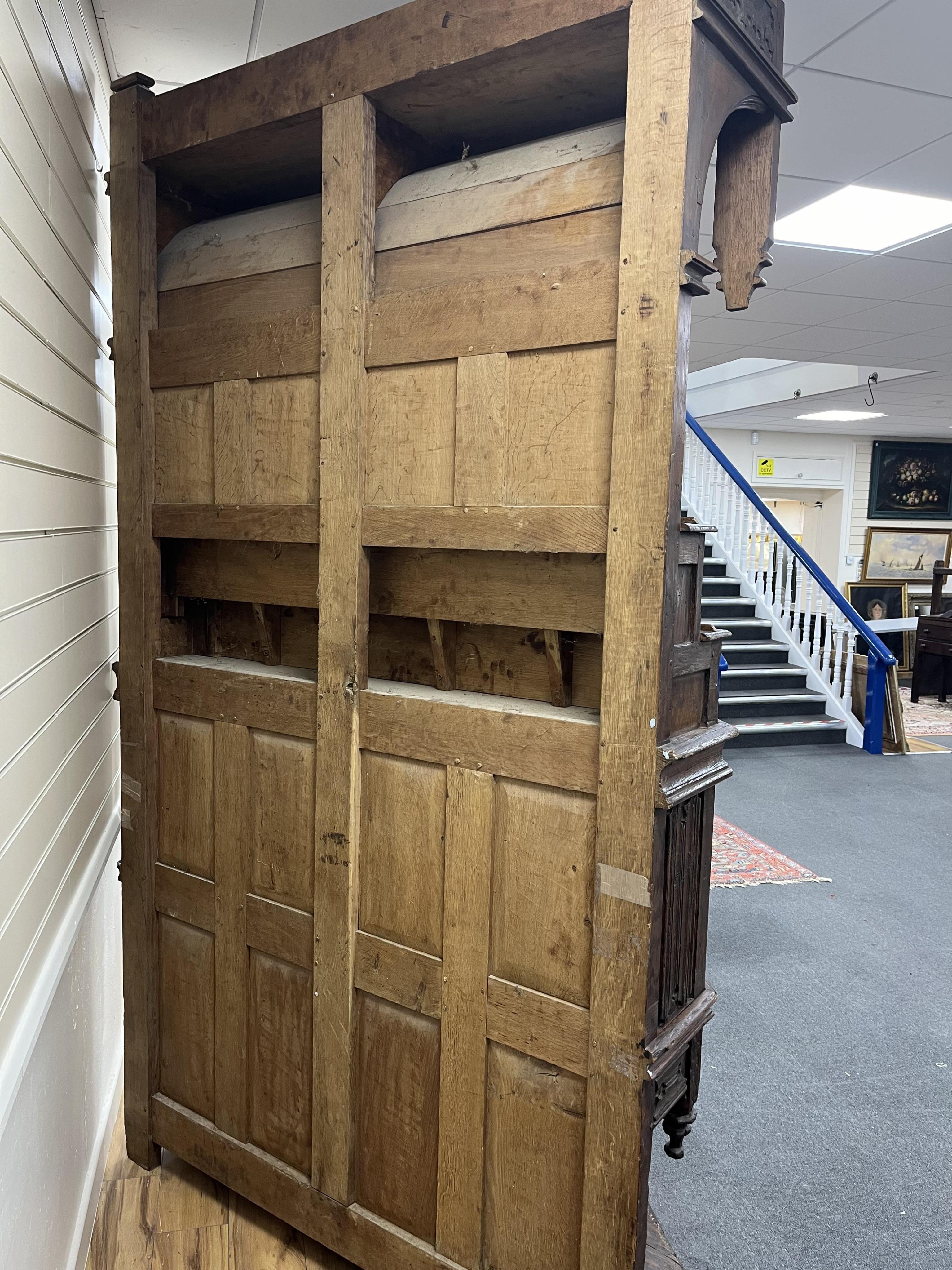 A tall Gothic linenfold panelled oak dresser (dressoir), in 15th century French style, width 143cm, depth 62cm, height 252cm. Condition - fair to good, Provenance - made for Brede Place, Brede, Rye, East Sussex. Commissi